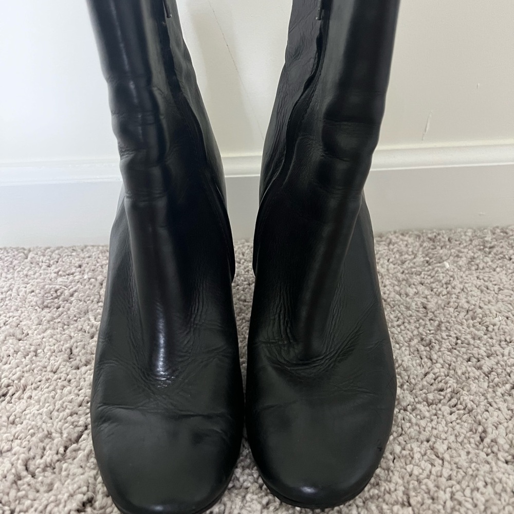 Black, Frye, soft grain leather booties with no platform.